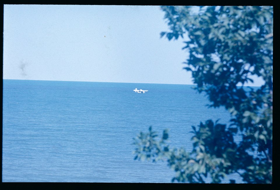 Pontoon Plane over lake 1975 -2